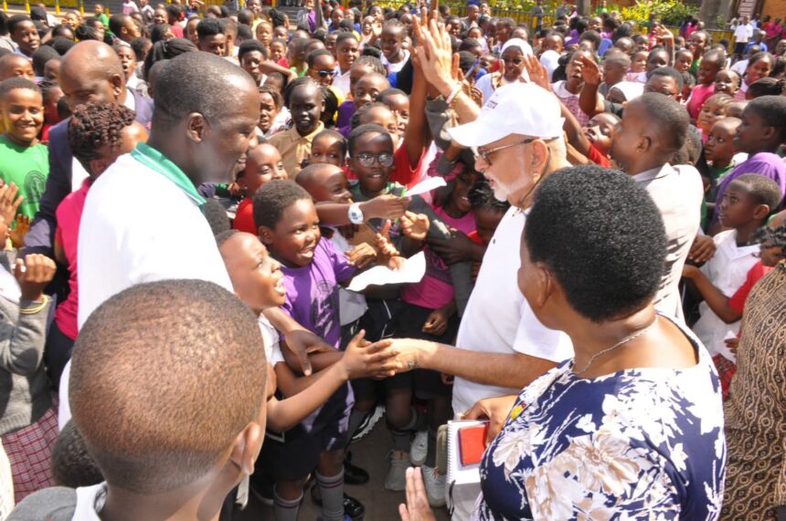 Pupils Mob Dr. Sudhir Ruparelia for Autographs During Surprise Visit to Kampala Parents’ School
